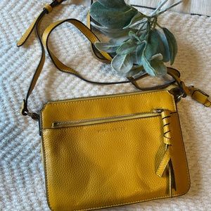 Vince Camputo golden purse.